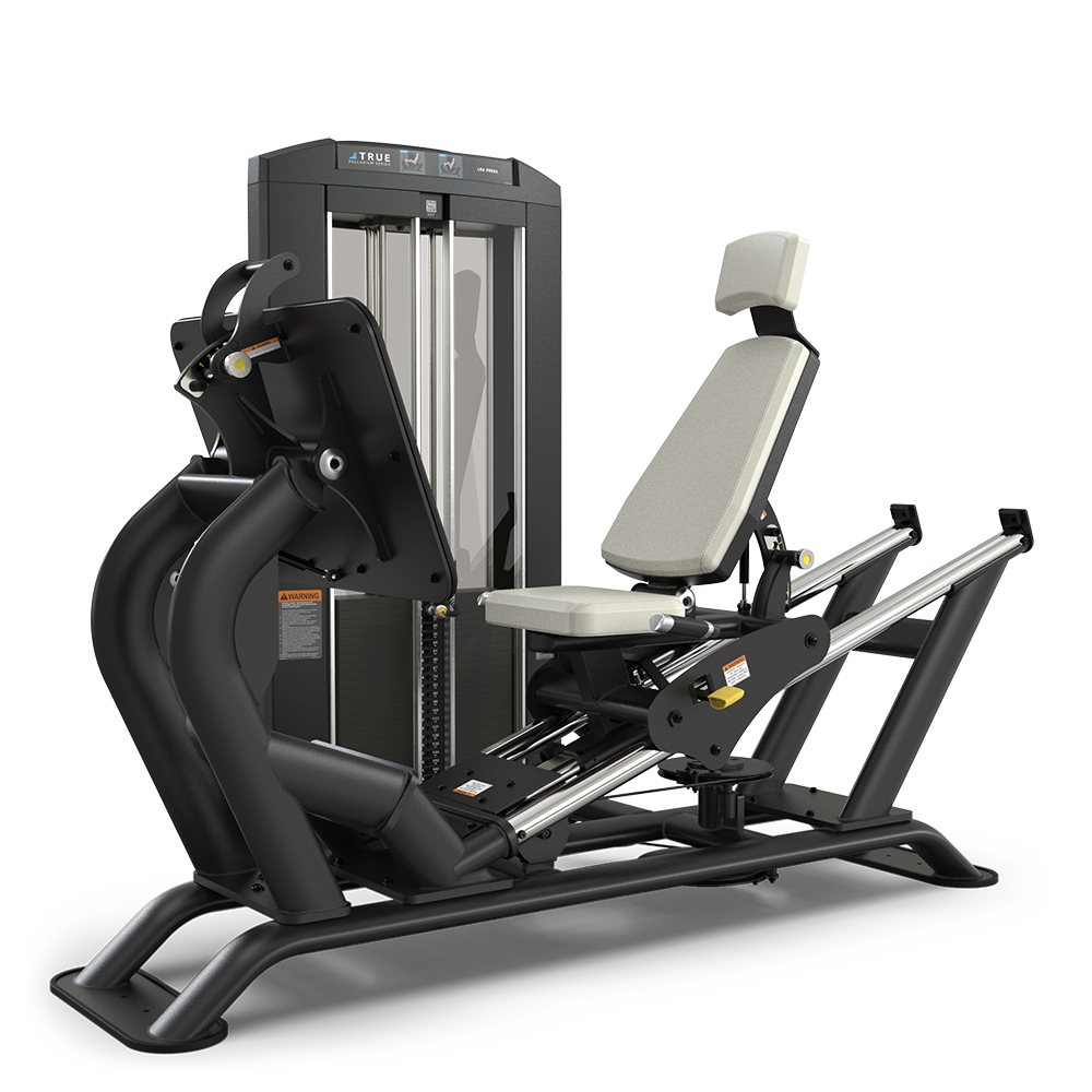 A black and silver leg press machine with a padded beige seat and backrest, adjustable footplate, and weight stack, designed for lower body strength training in a gym.