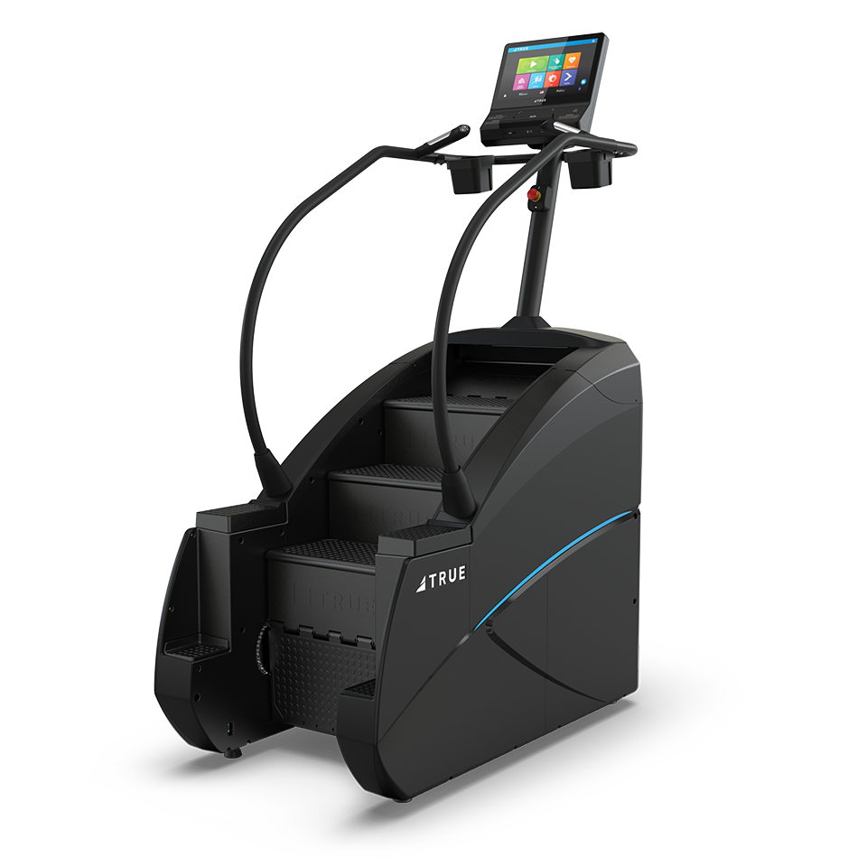 A black stair-climbing exercise machine with handrails, a built-in touchscreen display, and the brand name TRUE on the side, set against a plain white background.