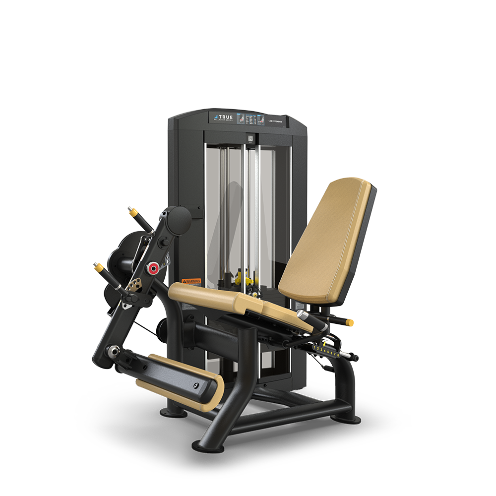 A commercial leg extension machine with a padded seat and backrest, weight stack, and adjustable padded rollers for leg exercises. The frame is black with tan upholstery and yellow adjustment handles.