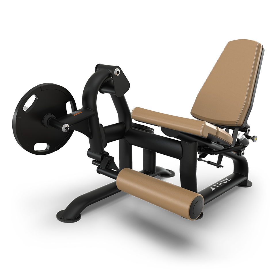 A black and tan leg extension machine with padded seat, backrest, and leg rollers, designed for strength training exercises in a gym setting.