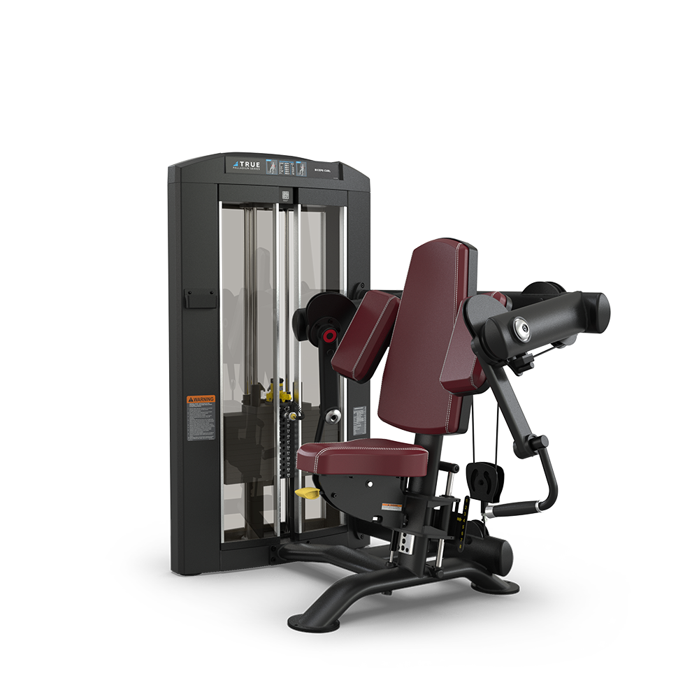 A maroon and black seated gym machine with padded armrests and backrest, designed for bicep curls, featuring a weight stack and adjustable settings on a sturdy metal frame.