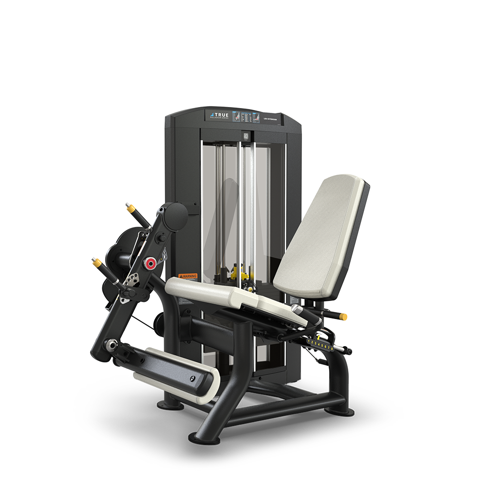 A black and gray seated gym machine with padded seat and backrest, designed for leg exercises, featuring adjustable weights, handles, and foot pad attachments against a plain white background.